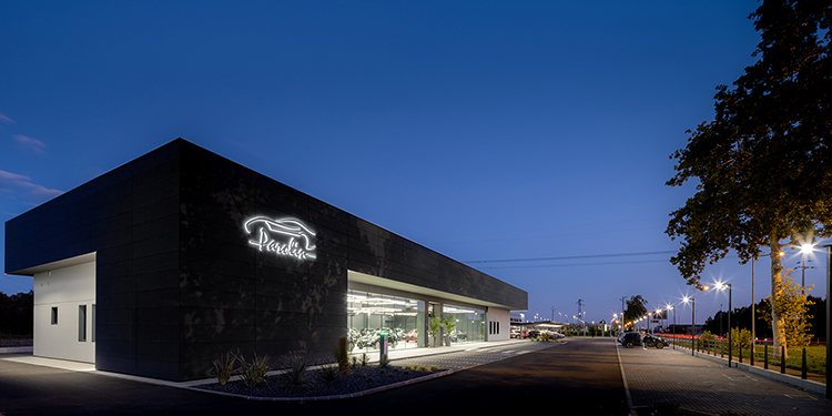 Car dealership by night