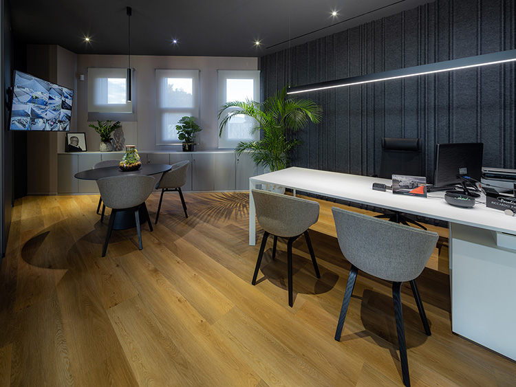 LED linear luminaires from Barthelme above a desk in the office